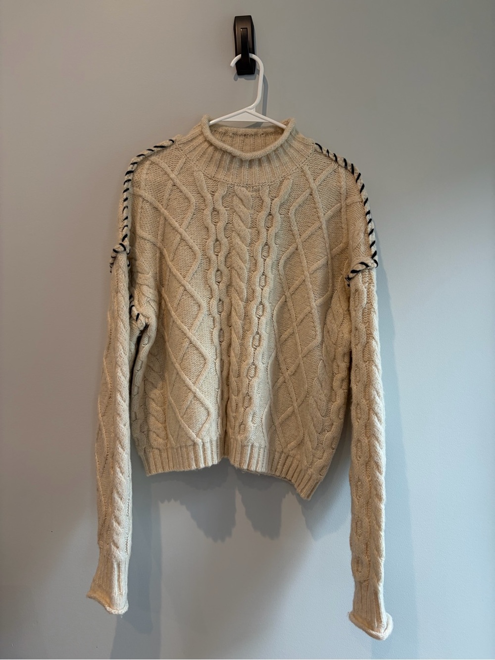 Cream Cable-Knit Sweater with Contrast Trim and roll neck